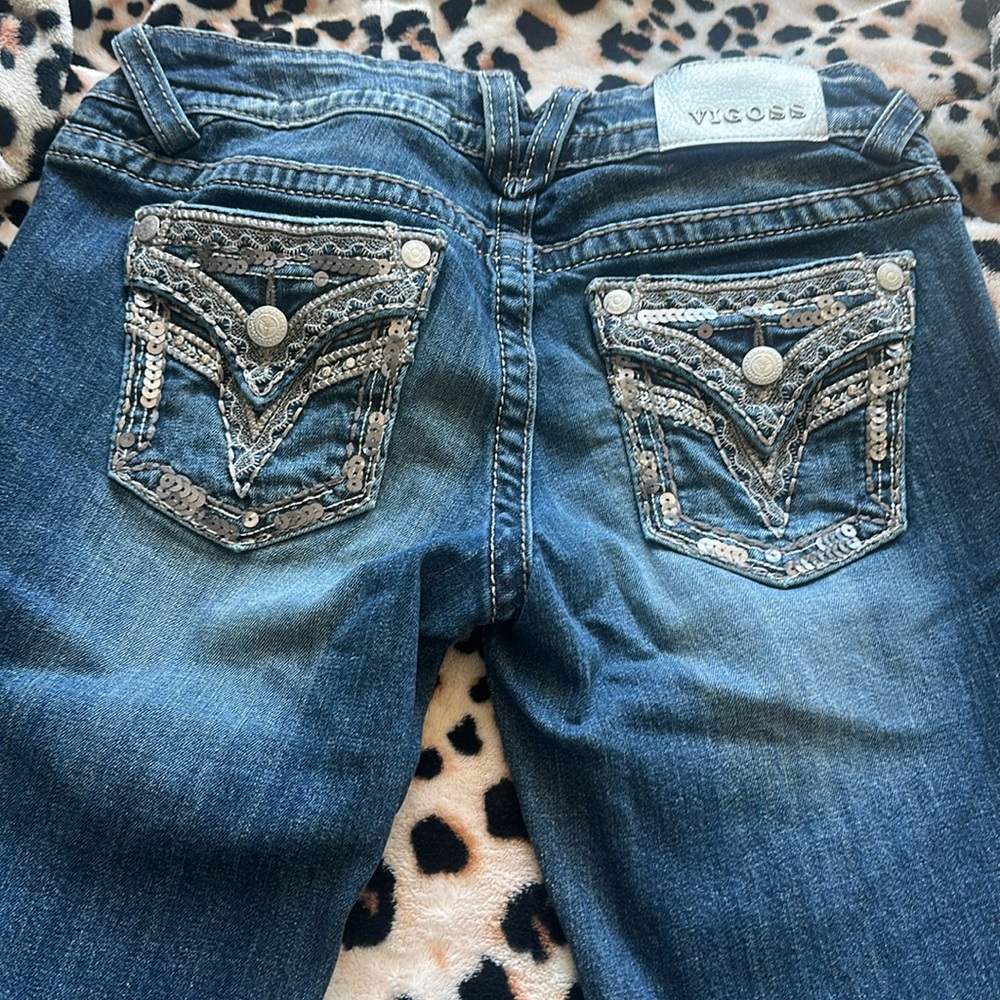 Vigoss designer jeans. Very stylish. Bling on back pockets. Excellent condition